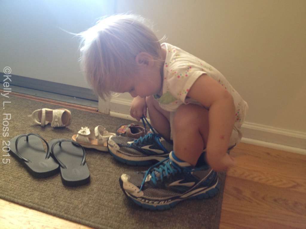My niece checks the fit of my shoes